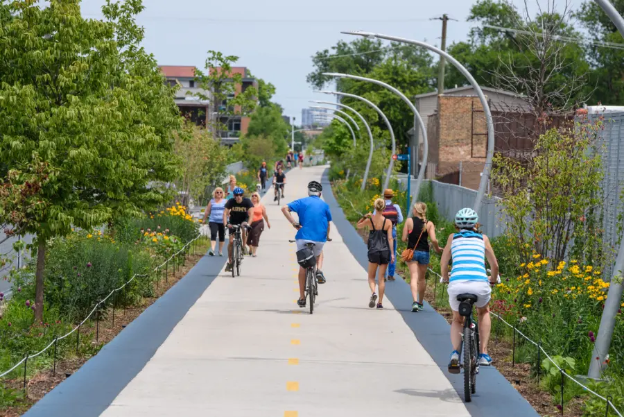 a group of chicagoans riding bicycles on the 606 path